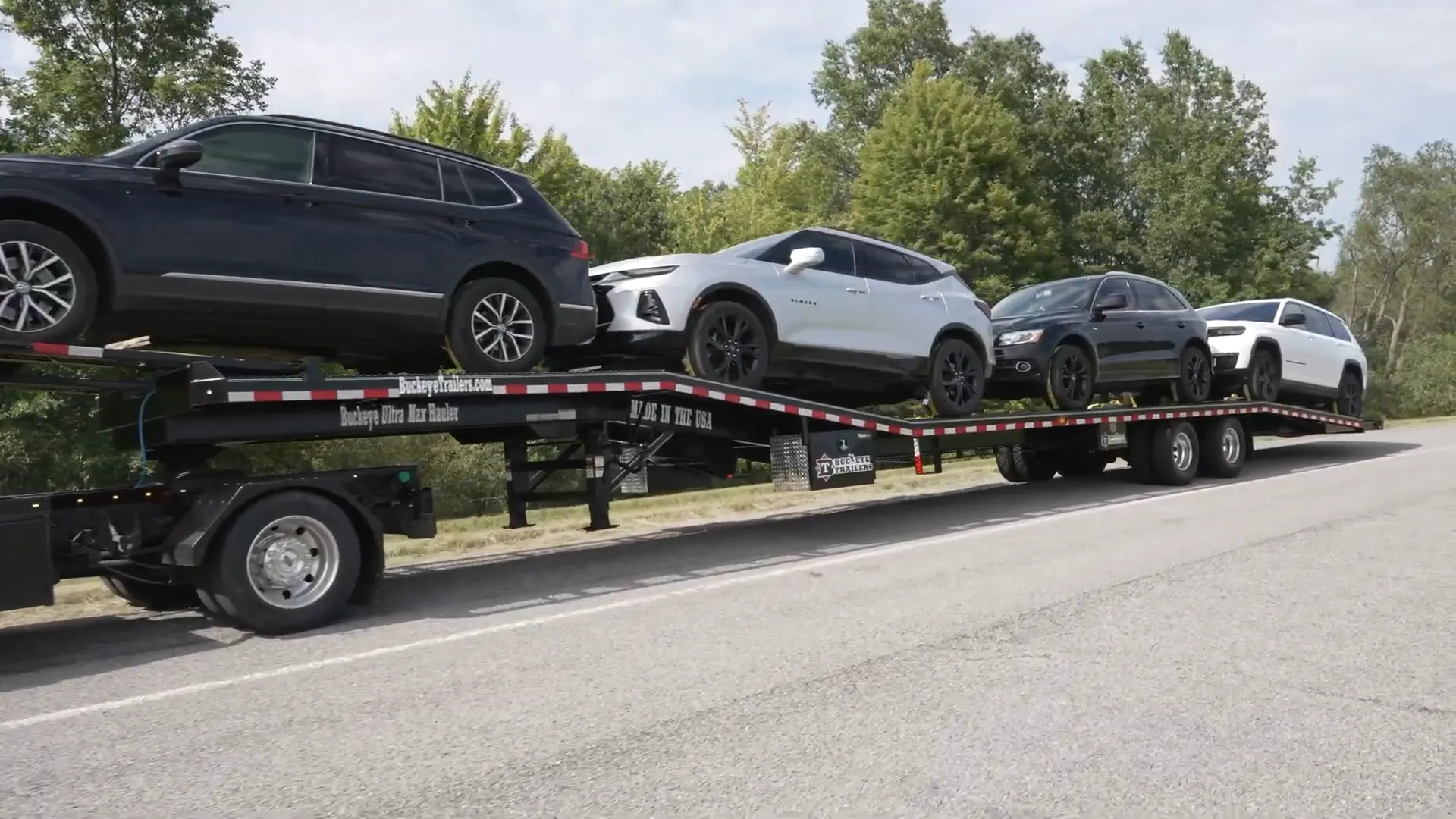 Buckeye Ultra Max 53 loaded with four vehicles